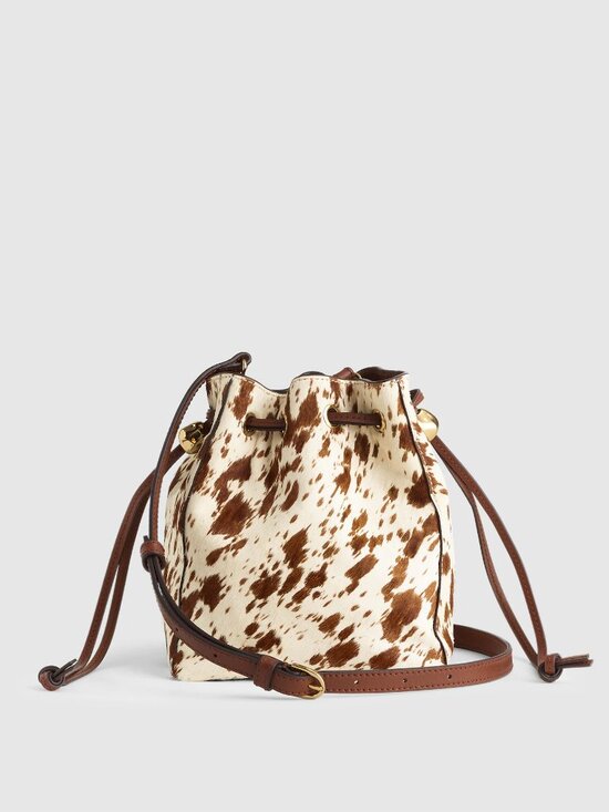 Madewell Handbags - The Mini Drawstring Crossbody Bucket Bag Cow Print